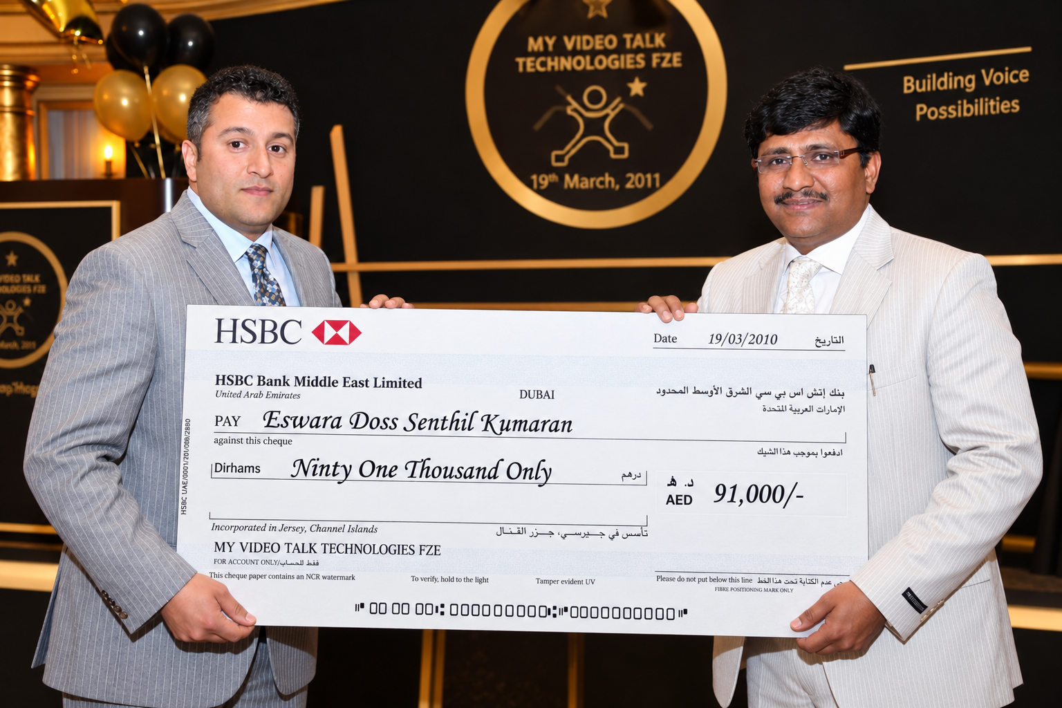 A large HSBC cheque presented on stage in front of the My Video Talk Technologies FZE 19 March 2011 backdrop